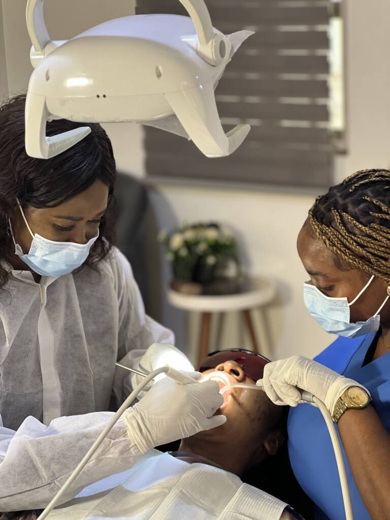 smilesdotcom doctor working on patient
